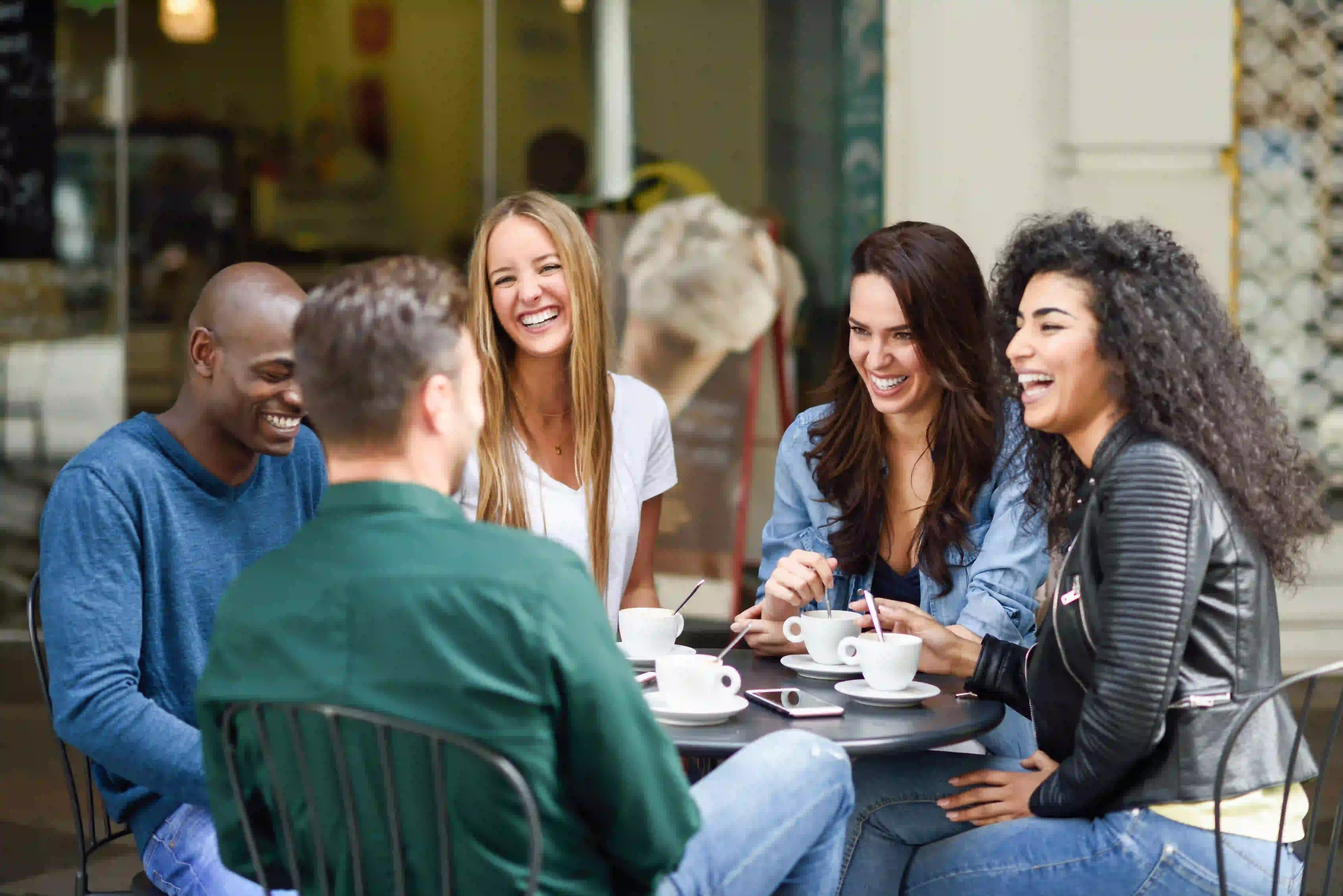 small group of men and women laughing