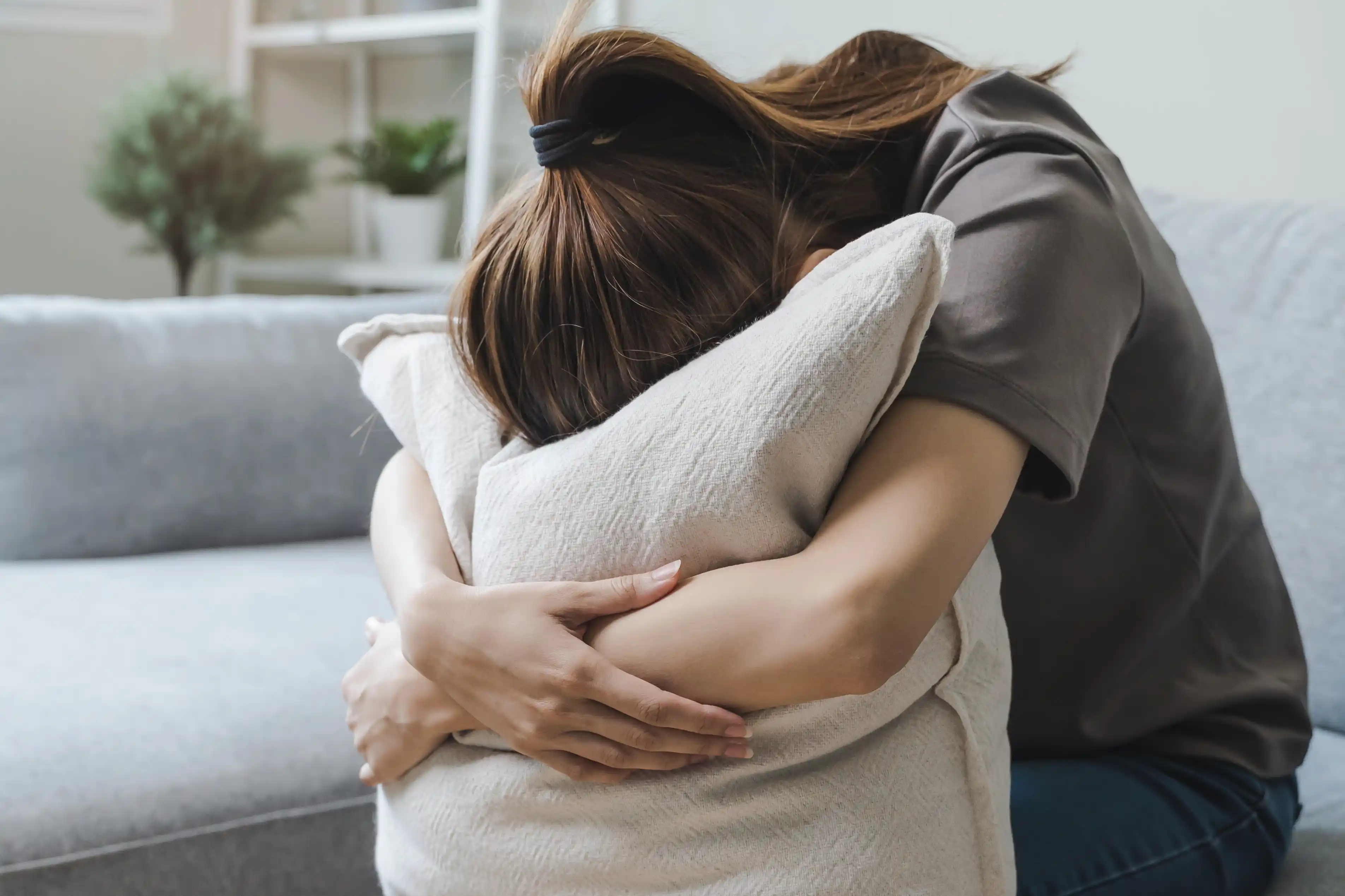 crying lady with a pillow