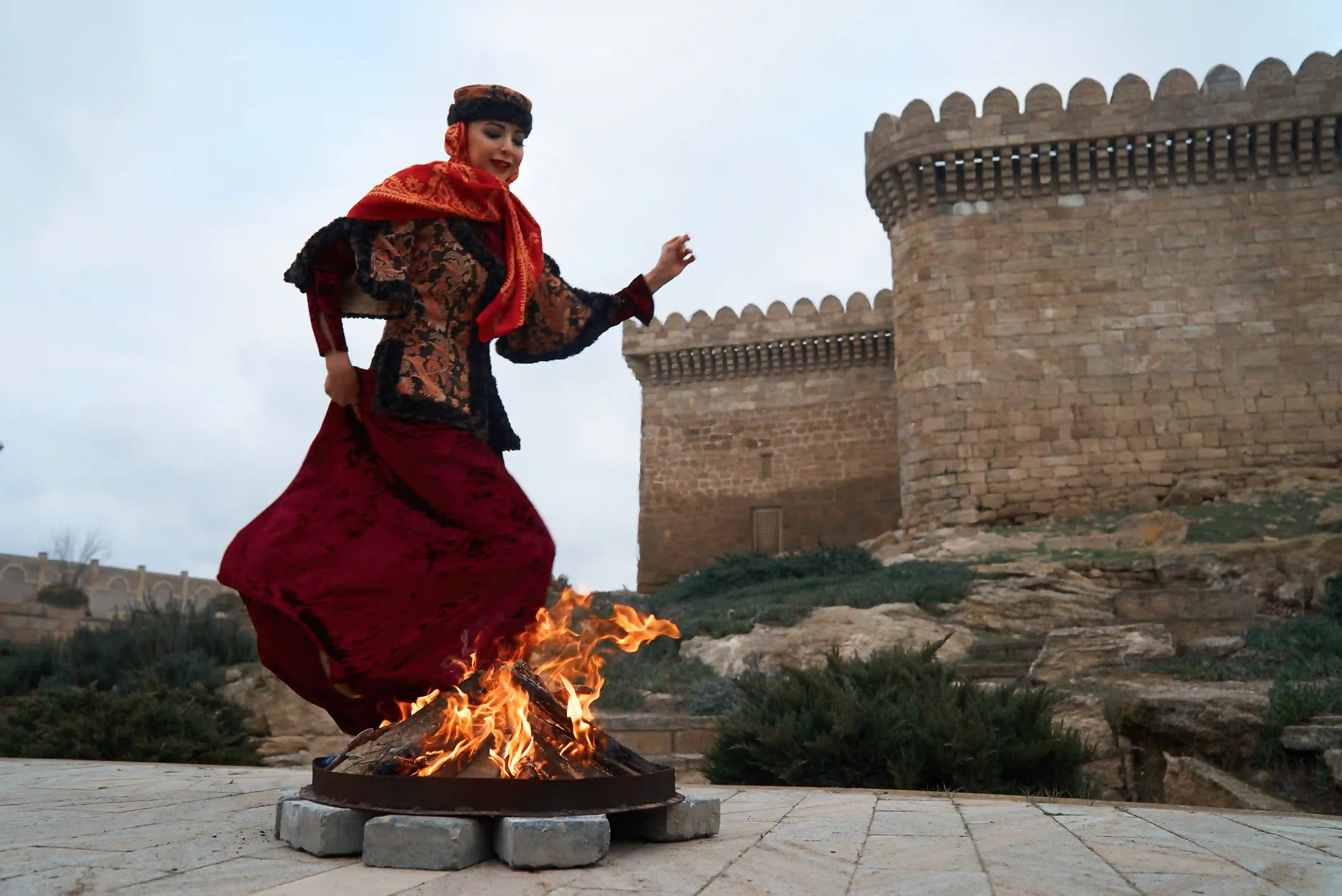 Azeri woman dancing around fire