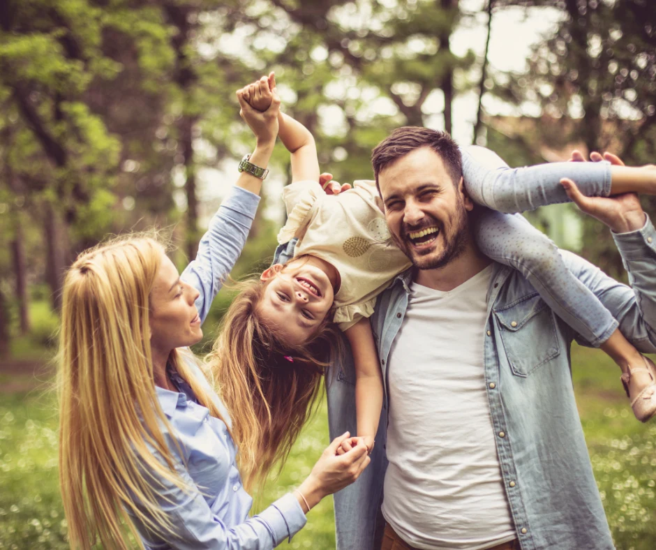 family with one daughter laughing