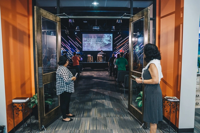 two women standing in front of the door