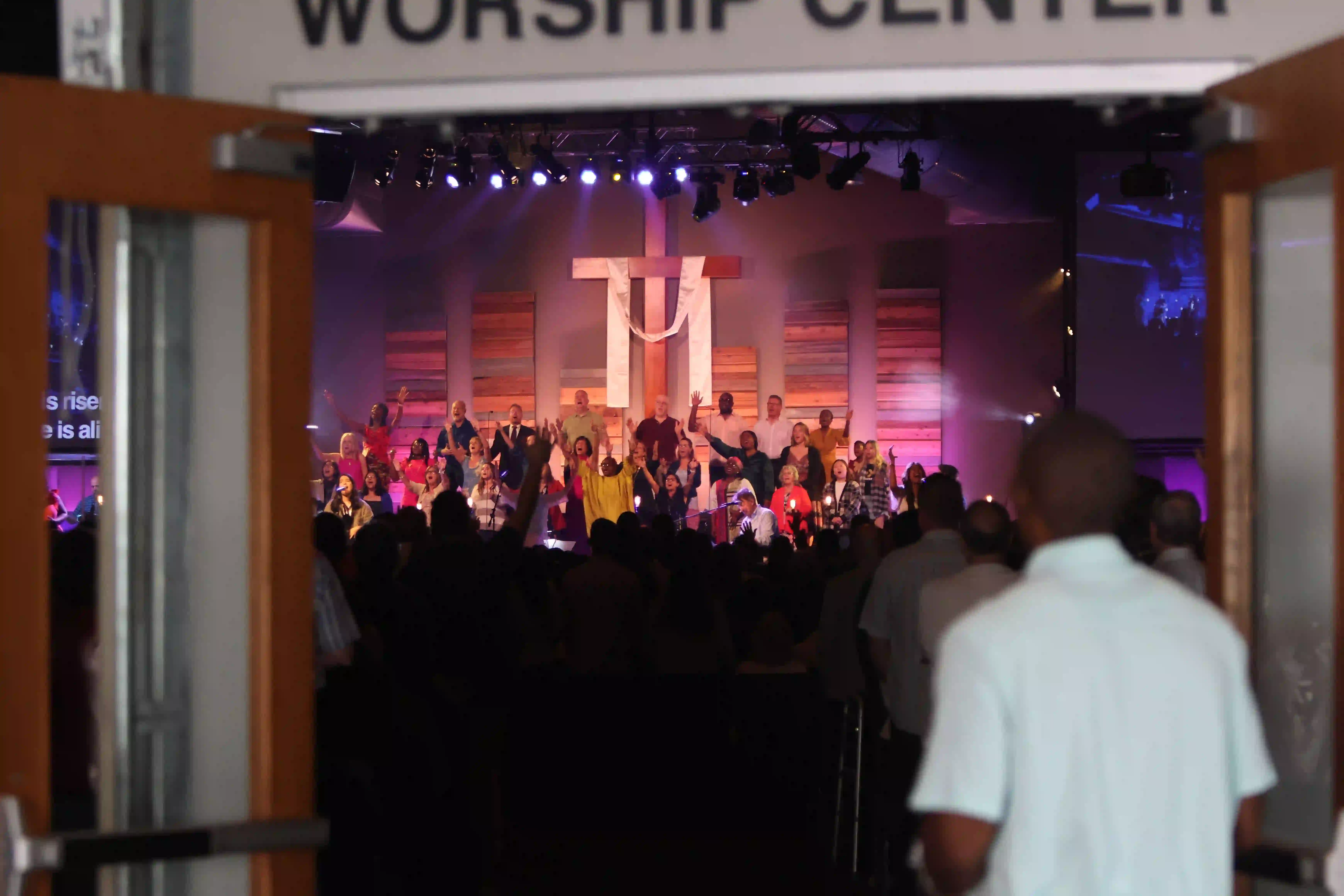 people singing in front of congregation