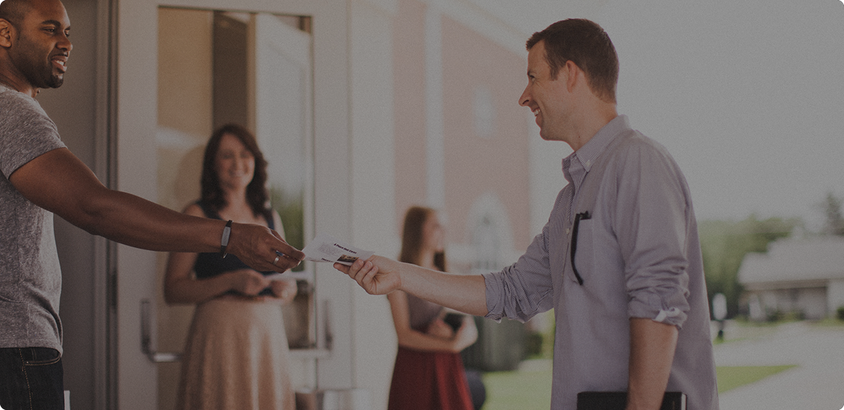 man giving pamphlet